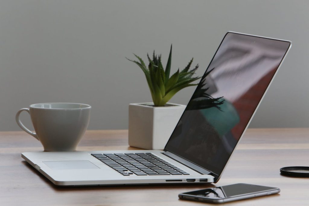 macbook thin -Silver Laptop and White Cup on Table