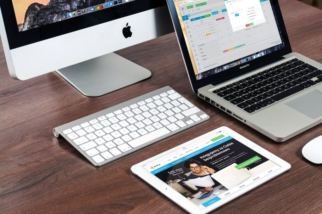 mac laptops - Turned on Imac Beside Macbook on Table